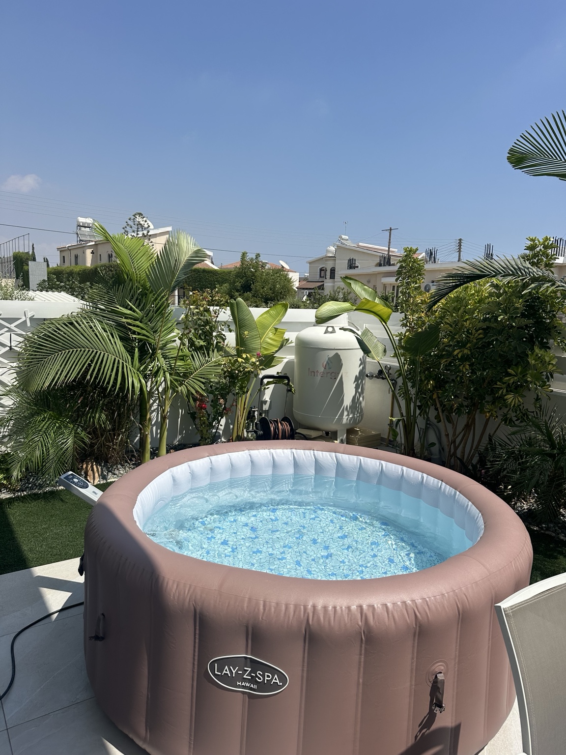 Close-up of an inflatable hot tub with clear bubbling water